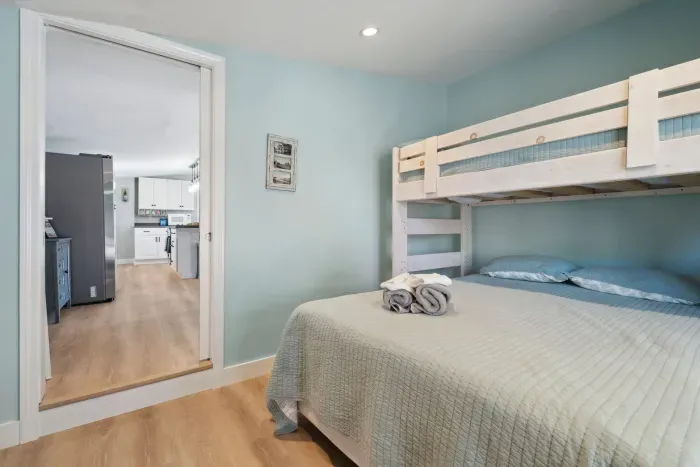 The second bedroom with twin over full bunk bed and access to the side deck