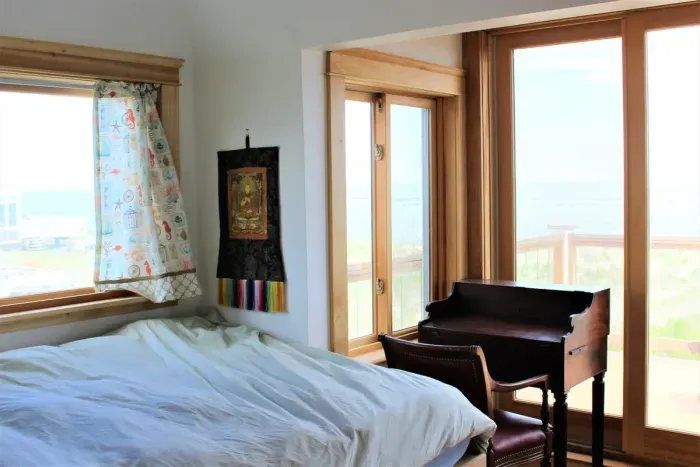 Bedroom #2 on 2nd floor with full bed and balcony access overlooking the Atlantic.