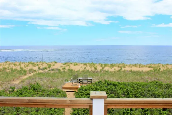 Bedroom #2 on 2nd floor with full bed & balcony access overlooking the Atlantic