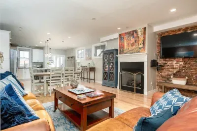 Beautiful & expansive open concept living room/kitchen with patio access.  NOTE: the fireplace is inoperable and may not be used.