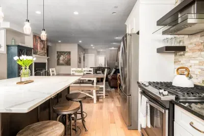 A dream chef's kitchen, with top appliances, perfect for dining and entertaining