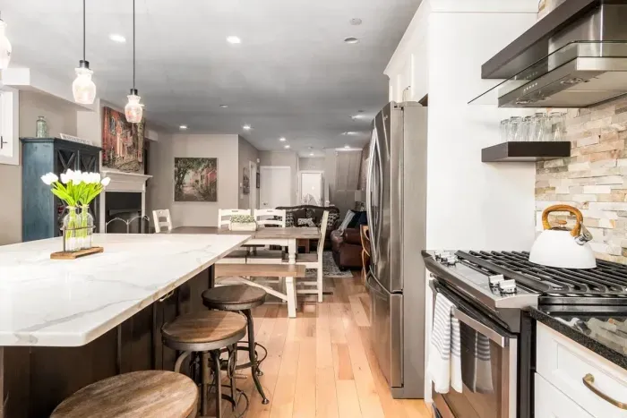 A dream chef's kitchen, with top appliances, perfect for dining and entertaining