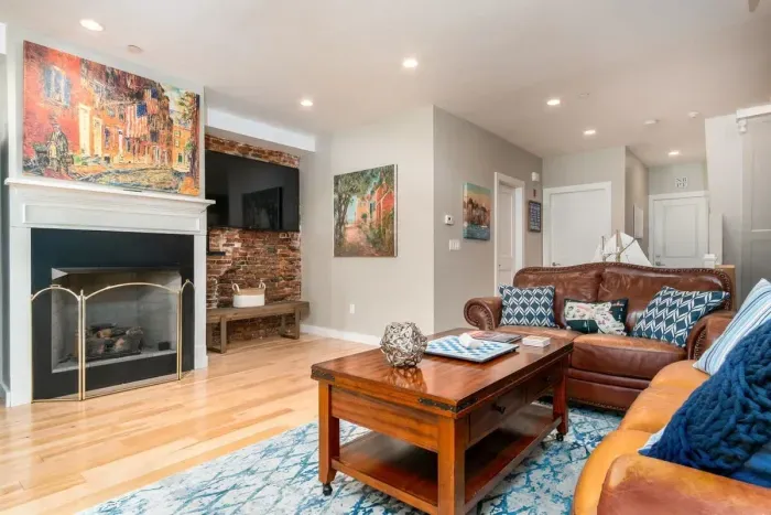 Beautiful & expansive open concept living room/kitchen with patio access. NOTE: the fireplace is inoperable and may not be used.