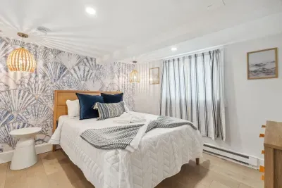 The primary bedroom with Queen bed, Smart TV, and completely new design! Clean linens provided!