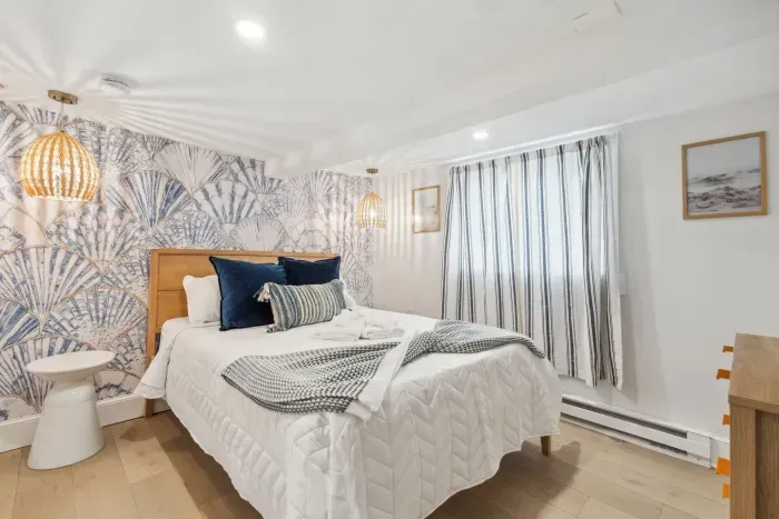 The primary bedroom with Queen bed, Smart TV, and completely new design! Clean linens provided!