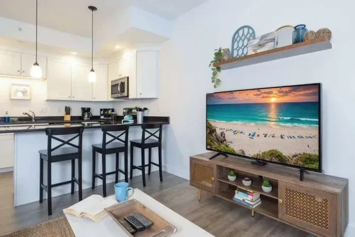 Open concept living space with flat screen TV