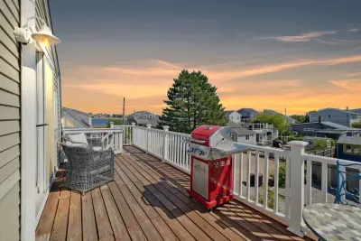 Plum Island basin views from the deck! Please note - the access to the unit is up the flight of stairs pictured in the photo at the end of the deck. Please see the walkthrough video for entry details.