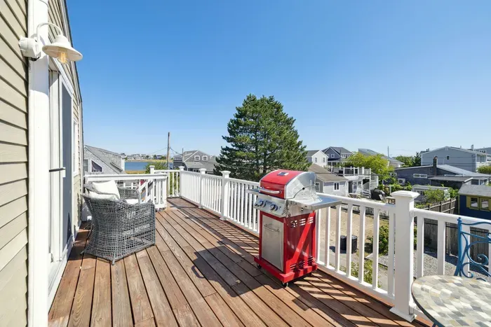 Plum Island basin views from the deck! Please note - the access to the unit is up the flight of stairs pictured in the photo at the end of the deck. Please see the walkthrough video for entry details.