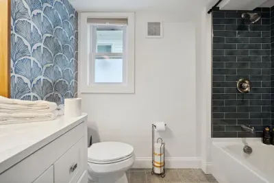 The main bathroom with a beautifully tiled shower/tub combo!