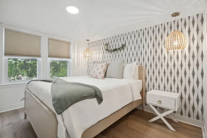 This Queen bedroom is beautifully furnished with new furniture and a stunning accent wall!