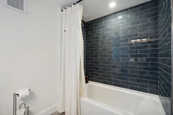 The main bathroom with a beautifully tiled shower/tub combo!
