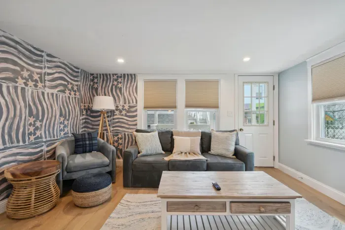 Professionally designed and super comfy! This family room has a smart Roku TV and seating for 4