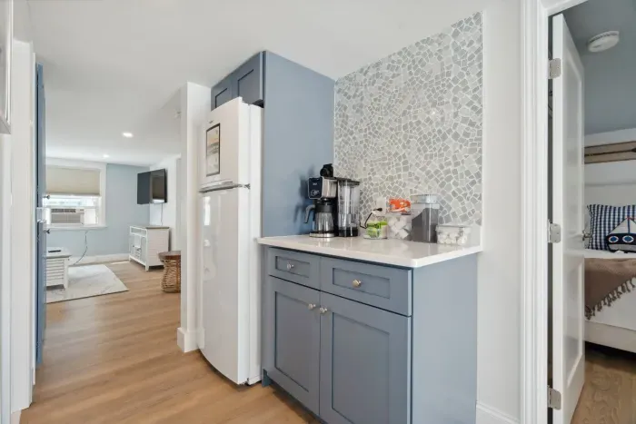 The newly renovated kitchen! New appliances and cabinets all around. This fully equipped kitchen has seating for 4 at the kitchen table (no dishwasher)