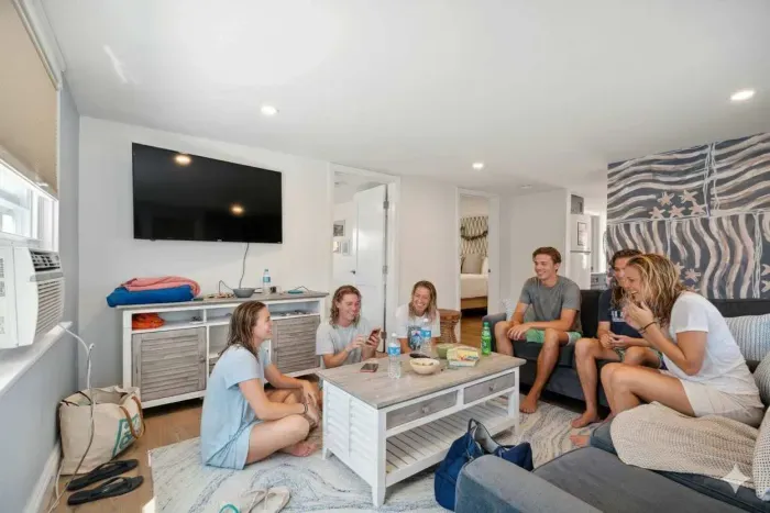 This family room has a smart Roku TV and seating for 4