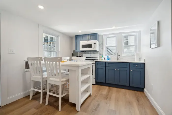 The newly renovated kitchen! New appliances and cabinets all around. This fully equipped kitchen has seating for 4 at the kitchen table (no dishwasher)