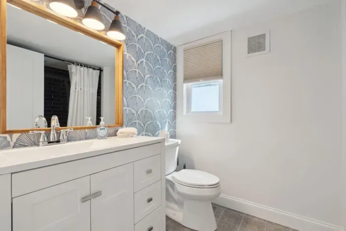 The main bathroom with a beautifully tiled shower/tub combo!