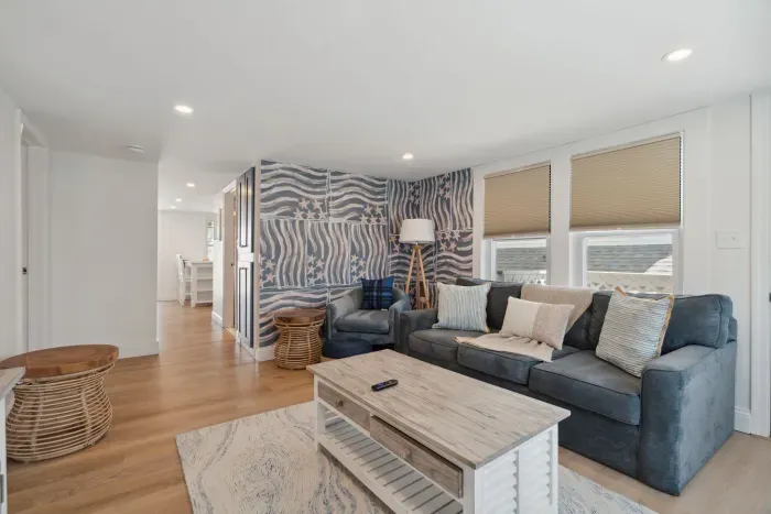 Professionally designed and super comfy! This family room has a smart Roku TV and seating for 4