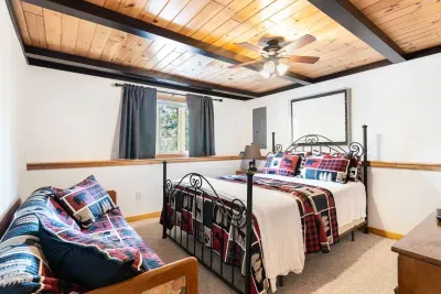 This is bedroom #2 with the queen bed, Roku smart TV, and couch. Clean linens provided