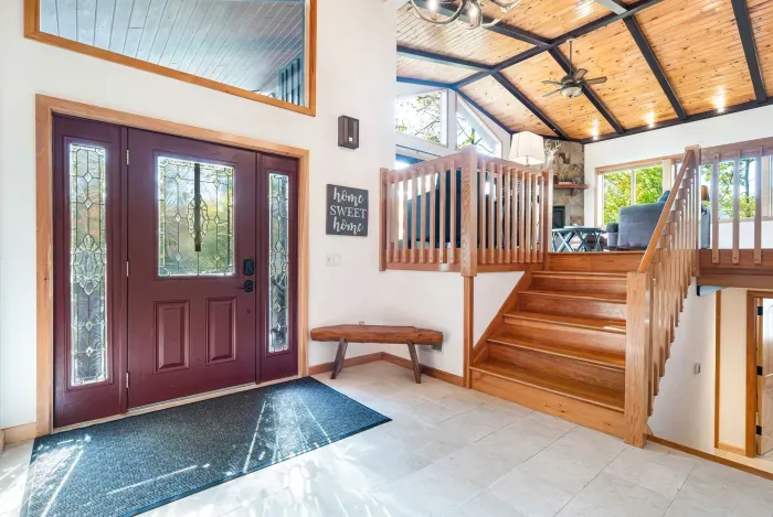Step into this beautiful home! This foyer is open to the downstairs sleeping quarters and the great room on the second floor!