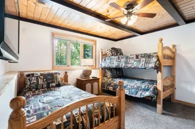 The bunk room! Roku smart TV and comfy chair are in this room. The perfect room for kids!
