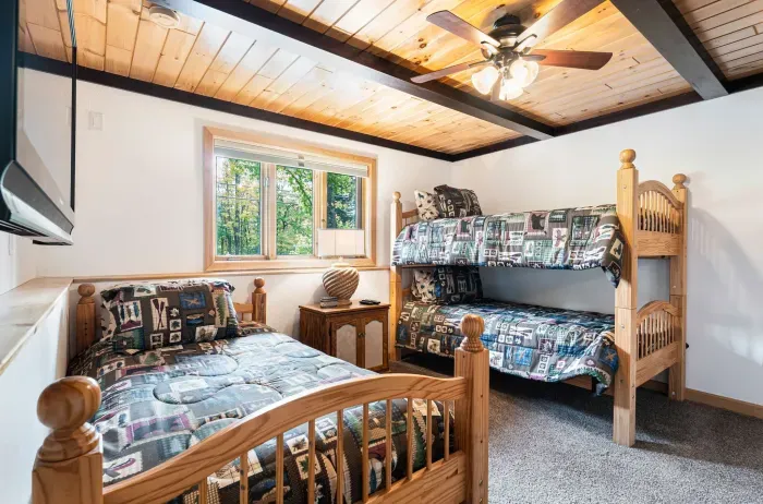 The bunk room! Roku smart TV and comfy chair are in this room. The perfect room for kids!