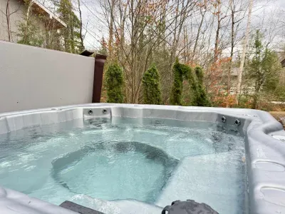 Hop in :) The hot tub is available all year long. This hot tub is BRAND NEW as of November 2024. Please treat it with respect.