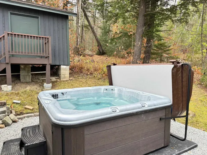 This professionally serviced hot tub is located right off the garage for easy access!