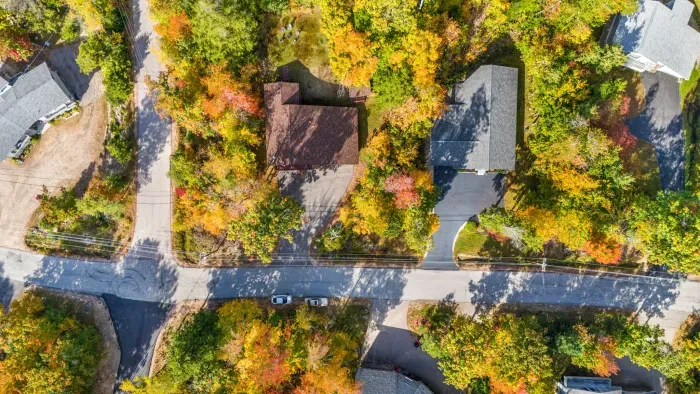 The brown roof is the home. This home is perfectly situated on a corner lot!
