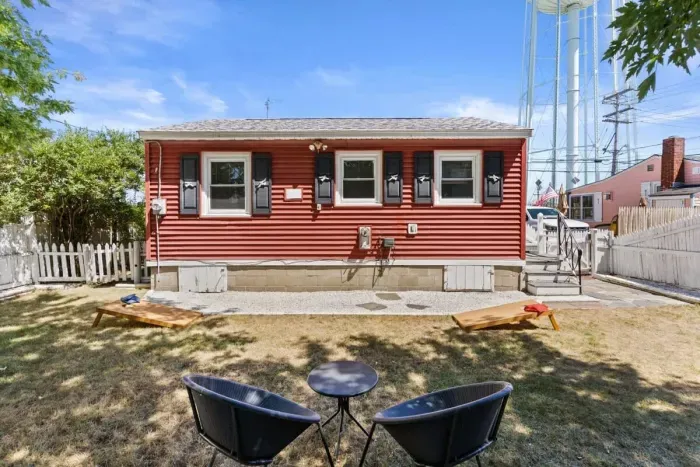 Fenced-in back yard, with lawn games, picnic table and gas grill perfect for relaxing.
