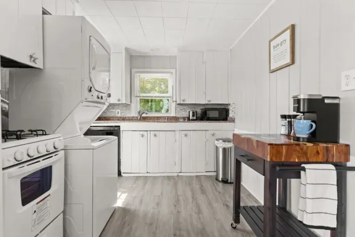 Fully stocked & equipped kitchen with in-house stackable laundry
