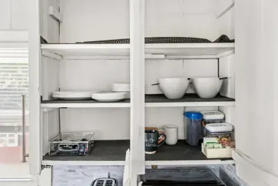 cupboard for bowls, plates, coffee, creamer & tea