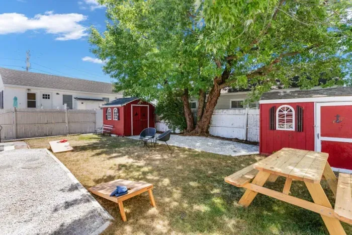 Fenced-in back yard, with lawn games, picnic table and gas grill perfect for relaxing.