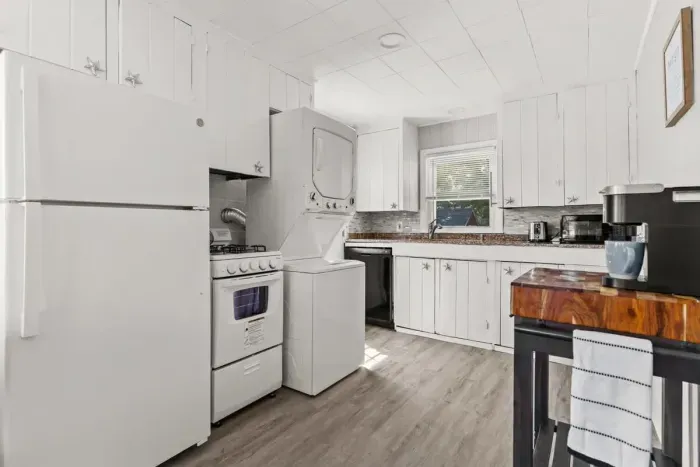 Fully stocked & equipped kitchen with in-house stackable laundry