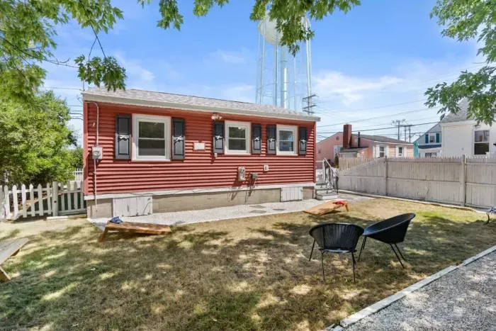 Fenced-in back yard, with lawn games, picnic table and gas grill perfect for relaxing.