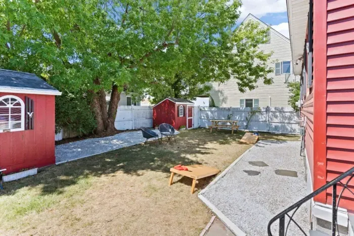 Fenced-in back yard, with lawn games, picnic table and gas grill perfect for relaxing.