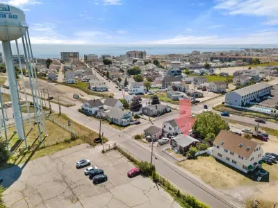 Aerial views - Walkable to the beach, off-street parking for up to 4 cars, private fenced in yard.