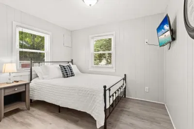 Bedroom #1 with queen bed and Roku Smart TV