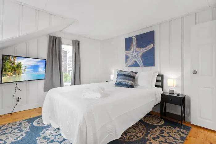 Bedroom #2 with queen bed and smart TV