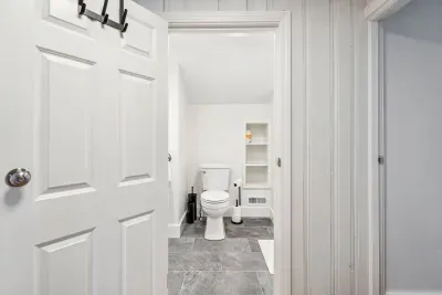 The BRAND NEW second floor bathroom! Equipped with a tiled standing shower. Clean towels provided for all guests