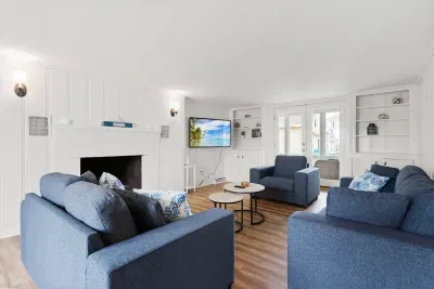 Spacious, open concept, living room with smart TV