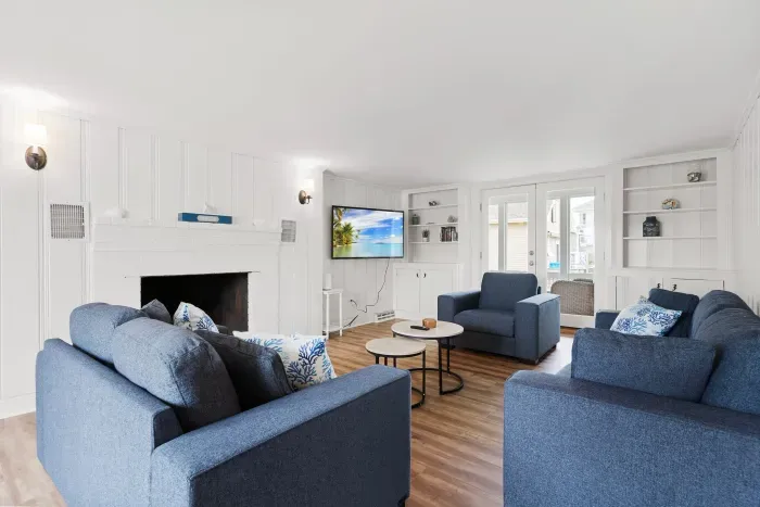 Spacious, open concept, living room with smart TV