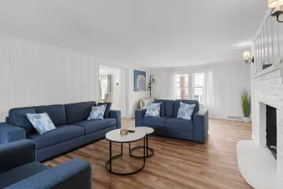 Spacious, open concept, living room with smart TV