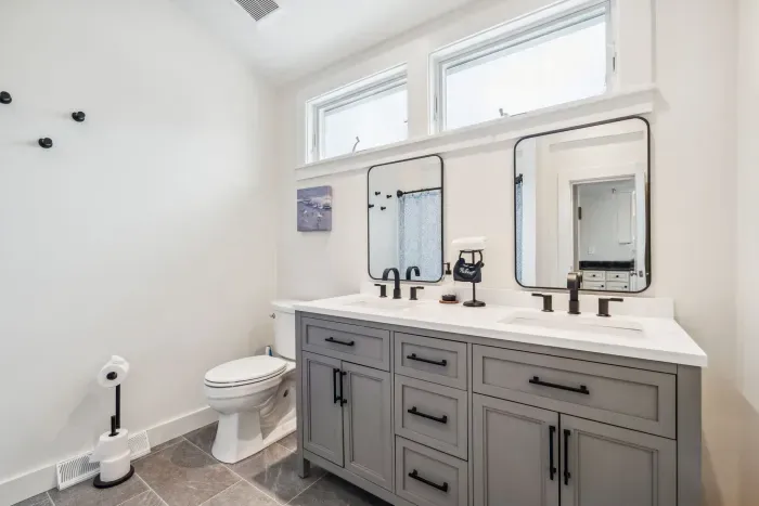 Fully renovated first floor bathroom with shower/tub combo and dual vanities. Clean towels provided for all guests