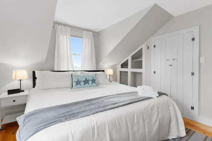 Primary bedroom with king bed and smart TV