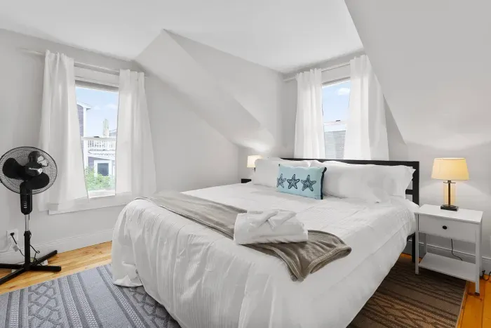 Primary bedroom with king bed and smart TV