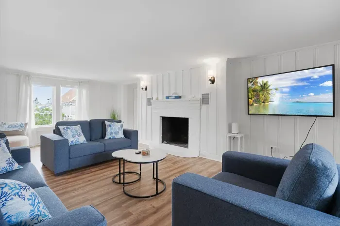 Spacious, open concept, living room with smart TV