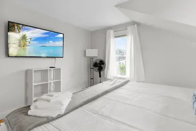 Primary bedroom with king bed and smart TV
