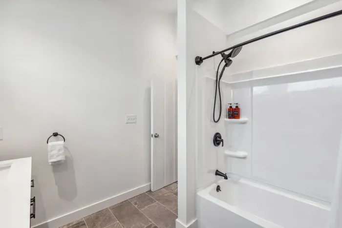 Fully renovated first floor bathroom with shower/tub combo and dual vanities. Clean towels provided for all guests