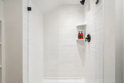 The BRAND NEW second floor bathroom! Equipped with a tiled standing shower. Clean towels provided for all guests