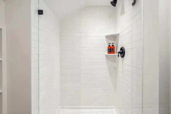 The BRAND NEW second floor bathroom! Equipped with a tiled standing shower. Clean towels provided for all guests